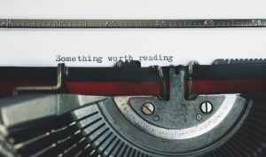 Image of a typewriter with the words, "to blog or not to blog."